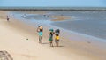 Locals collecting shellfish along the beach